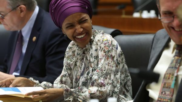 Rep. Ilhan Omar (D-MN) (C) listens to Rep. Andy Levin (D-MI) during a House Education and Labor Committee Markup on the H.R. 582 Raise The Wage Act, in the Rayburn House Office Building on March 6, 2019 in Washington, DC. (Mark Wilson/Getty Images/AFP)