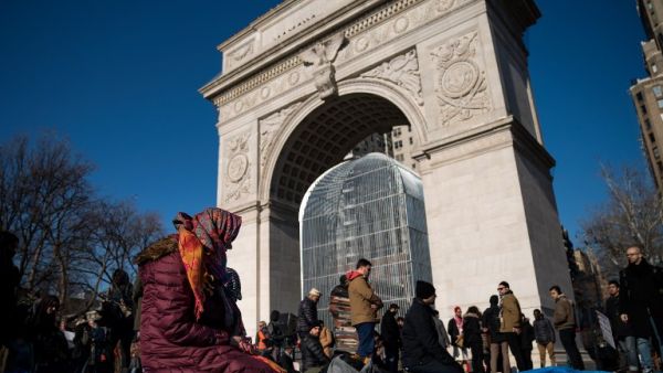NEW YORK, NY - JAN. 26: Muslims pray following a protest to the mark the one year anniversary of the Trump administration's executive order banning travel into the United States from several Muslim majority countries, in Washington Square Park, New York City. (Drew Angerer/Getty Images/AFP) 