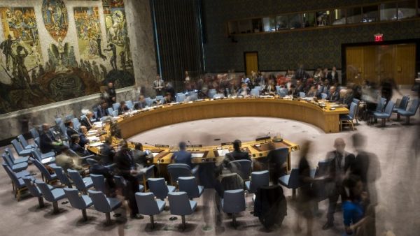 (FILES): In this long exposure photograph, the United Nations Security Council meets concerning the situation in the Middle East, at UN headquarters, April 26, 2018 in New York City. Israel claimed that Iran is using Syria to build a new military front against Israel. Among other topics discussed in the Security Council meeting included discussion about the mass protests along the border fence between the Gaza Strip and Israel. 
(Drew Angerer / GETTY IMAGES NORTH AMERICA / AFP)