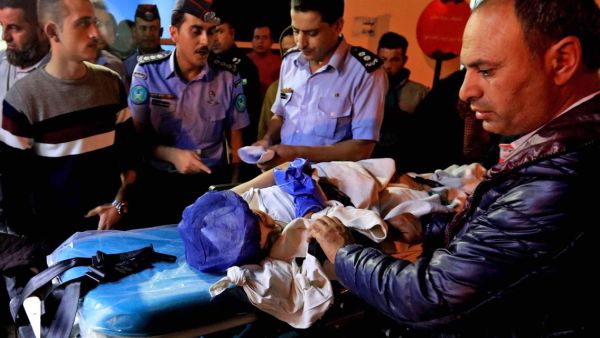 An injured pupil lays on a stretcher at a hospital in Jordan. ( AFP/ File)