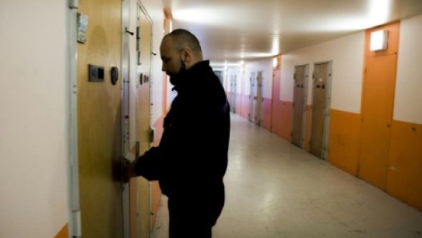 A supervisor locks the door of a cell in a prison (AFP/File Photo)	