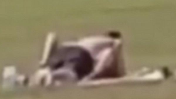 The couple's steamy session was interrupted as they enjoyed an outrageous display in front of children playing sports in a city centre park (Facebook)