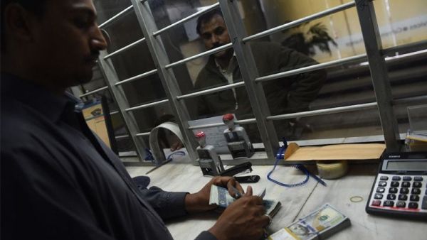 A dealer counts money at a currency exchange (AFP/File Photo)	