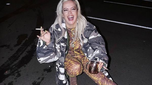 Smoking hot stuff: Lily Allen exhibited her fantastic figure in a tight bodysuit after performing in Colorado on Tuesday... as she claimed she put on FOUR stone during No Shame tour (Source: Lilly Allen - Instagram) Smoking hot stuff: Lily Allen exhibited her fantastic figure in a tight bodysuit after performing in Colorado on Tuesday... as she claimed she put on FOUR stone during No Shame tour (Source: Lilly Allen - Instagram)