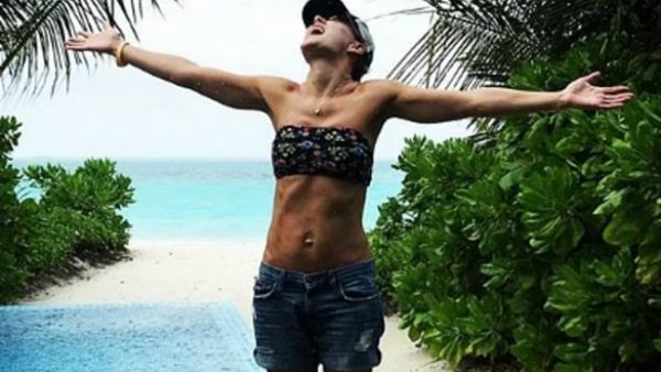 Breaktime: Emma Willis, 42, took a well deserved 'family moon' to the Maldives as she showed of her enviably trimmed body in a tiny bikini top and shorts (Source: emmawillisofficial - Instagram) Breaktime: Emma Willis, 42, took a well deserved 'family moon' to the Maldives as she showed of her enviably trimmed body in a tiny bikini top and shorts (Source: emmawillisofficial - Instagram)