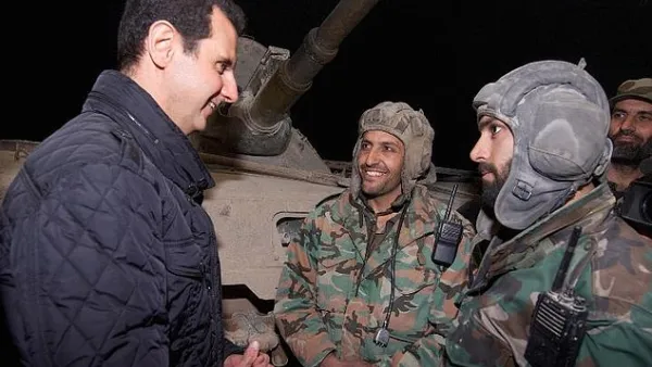 'I like to be with you on this occasion,' Assad told the Syrian troops in Jobar. (AFP/File)