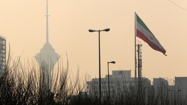 A general view of the Milad telecommunication tower engulfed by smog in the Iranian capital Tehran (AFP/File Photo)	