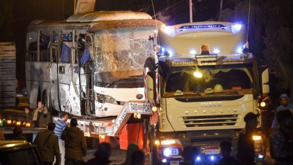 A tourist bus which was hit by a deadly bombing being towed away from the scene in Giza province south of the Egyptian capital Cairo (AFP)