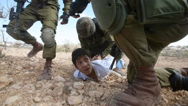 According to Palestinian prisoner rights group Addameer, 300 Palestinian minors are held in Israeli prisons (AFP/File)