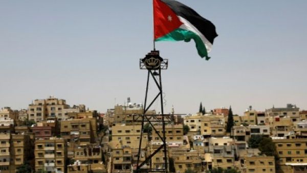 A Jordanian flag flutters above the Jordanian capital Amman. (AFP)