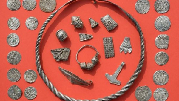  Braided necklaces, pearls, brooches, a Thor's hammer, rings and up to 600 chipped coins were found on the German island of Ruegen in the Baltic Sea (AFP/File Photo)	