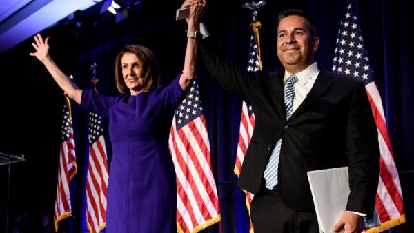 House Minority Leader Nancy Pelosi (D-CA) and Representative Ben Ray Lujan (D-MN), DCCC Chairman, celebrate a projected Democratic Party takeover of the House of Representatives during a midterm election night party hosted by the Democratic Congressional Campaign Committee on November 7, 2018 in Washington, DC. 
Brendan Smialowski / AFP