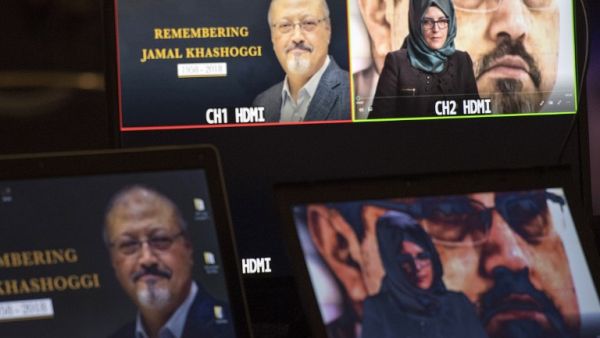 Hatice Cengiz, the fiancee of the late Washington Post journalist Jamal Khashoggi, delivers a prerecorded message (upper R) during a remembrance ceremony for her fiancée in Washington, DC (AFP)