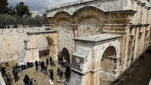 Palestinian Muslim worshippers attend Friday noon prayers at the Golden Gate in al-Aqsa Mosque compound in the Old City of Jerusalem (AFP)
