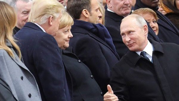Trump and Putin in discussion as the ceremony at the Arc de Triomphe gets underway on Sunday morning (AFP)