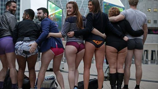 Another group posed at Canada Wharf as they took part in the No Trousers On The Tube event (AFP)