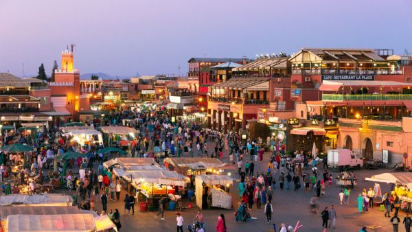 ourists and locals on the Djemaa-el-Fna square during sunset in Marrakesh (Shutterstock)