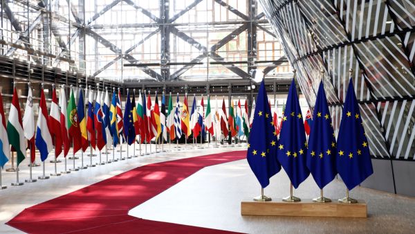 EU flags in EU Council building during the EU Summit (Shutterstock)