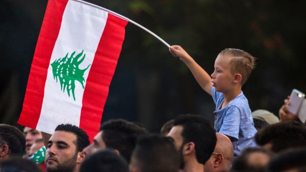 A boy with the flag of Lebanon (Shutterstock)	