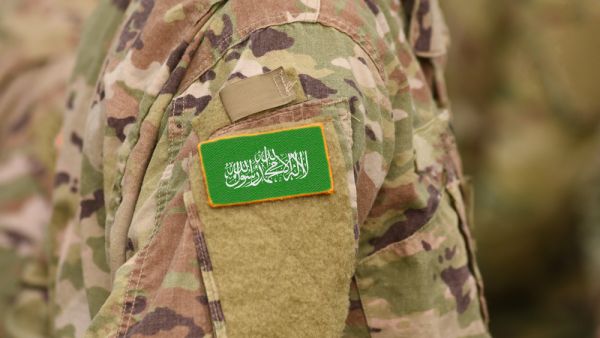 Flag of Hamas on soldier arm (Shutterstock)