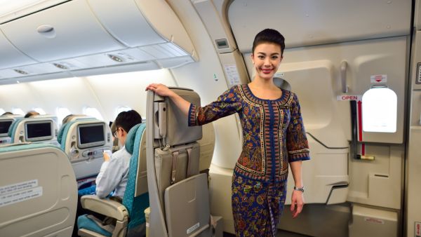 Singapore Airlines crew member on board (Shutterstock)