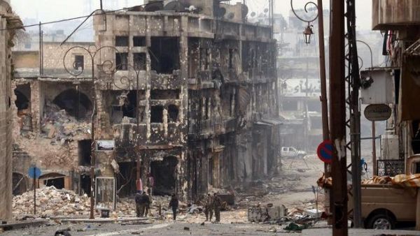Syrian government troops take position in a heavily damaged area in the old city of Aleppo. (AFP PHOTO/STR)