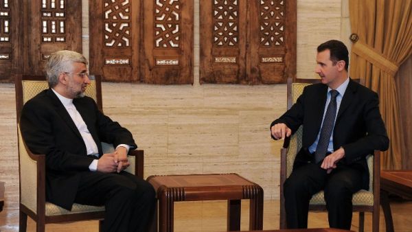 Syrian president Bashar al-Assad talks with Saeed Jalili, who heads the Iranian Supreme National Security Council in Damascus. (AFP PHOTO / HO-SANA)