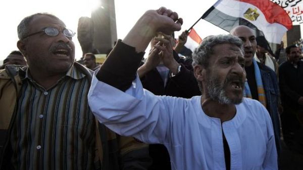 Egyptian anti-government protestors shout political slogans as they wave their national flag and banners during a march towards Cairo's landmark Tahrir. (AFP PHOTO/GIANLUIGI GUERCIA) Egyptian anti-government protestors shout political slogans as they wave their national flag and banners during a march towards Cairo's landmark Tahrir. (AFP PHOTO/GIANLUIGI GUERCIA)