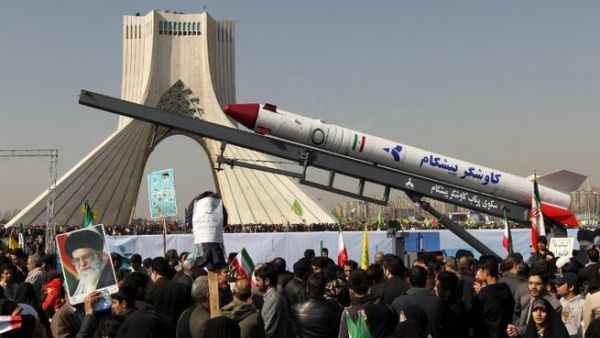 The capsule that was sent into space containing a live monkey in January is displayed during a rally in Tehran's Azadi Square (Freedom Square) to mark the 34th anniversary of the Islamic revolution. (AFP PHOTO / ATTA KENARE)
