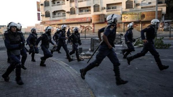 Bahrain police run as they try to disperse protestors during clashes following an anti-government rally to demand political reforms on Wednesday. (AFP PHOTO/MOHAMMED AL-SHAIKH)