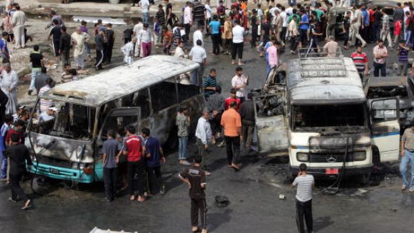 Iraqis gather at the scene of a car bomb explosion in Sadr city on April 23, 2010 in Baghdad, Iraq. (Photo by Getty Images)