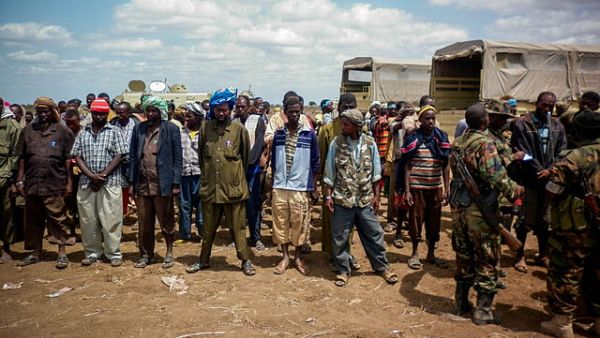 Members of Al Shabaab stand after giving themselves up to forces of the African Union Mission in Somalia 22 September 2012 (Wikimedia Commons)