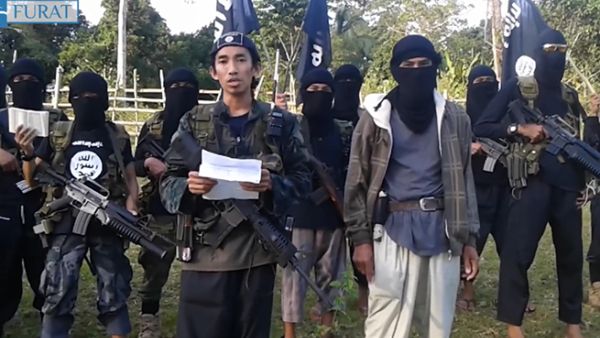 Abu Sayyaf militants marching in Philippines. (Screenshot)