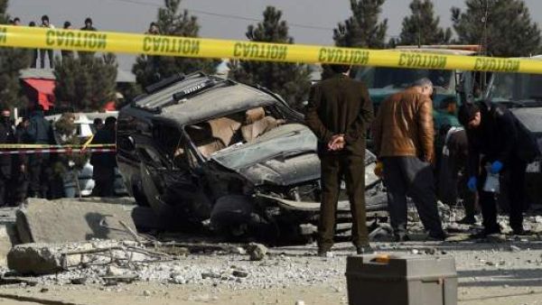 Afghan security personnel inspect a damaged vehicle after a roadside bomb explosion in Kabul. (AFP/ File Photo)