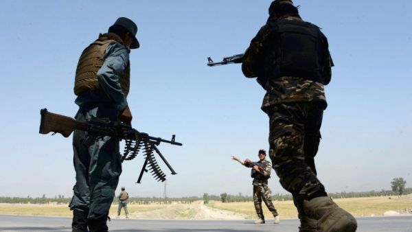 Afghan security personnel stand guard at a checkpoint on the outskirts of Jalalabad on April 28, 2017. (AFP/Noorullah Shirzada)