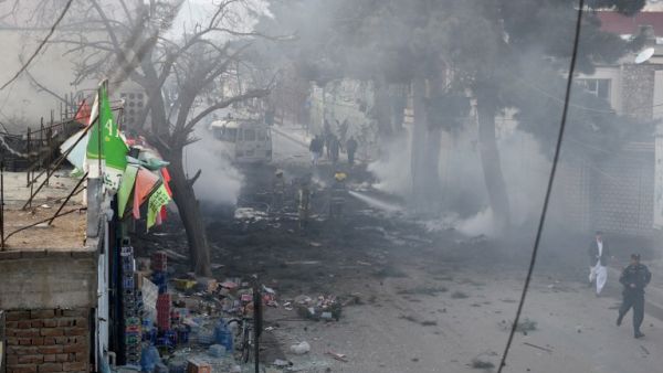 Afghan firefighters work to extinguish fire at the site of an explosion in Kabul on March 13, 2017. (AFP/Wakil Kohsar)