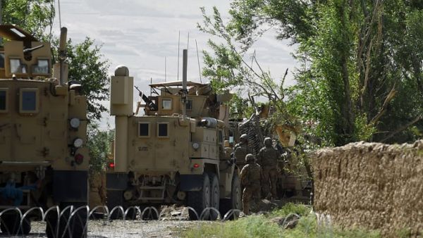 US soldiers inspect the site of a separate roadside bomb blast at Abed Kheel near Charikar district of Parwan province on May 19, 2017. (Wakil Kohsar/AFP)