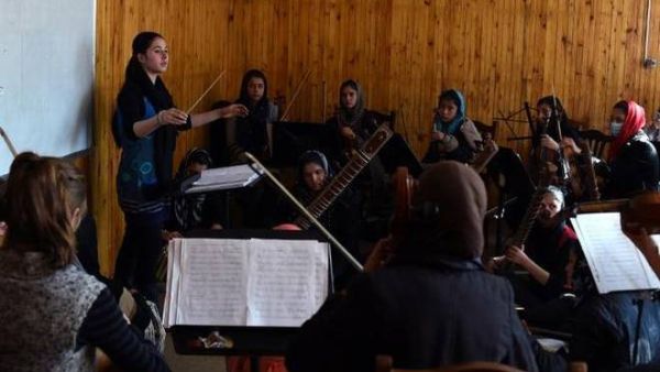 In this January 8, 2017 photo, Negina Khpalwak (19), the first female orchestra conductor in Afghanistan, is seen during a rehearsal at the National Institute of Music in Kabul. (AFP/File) 