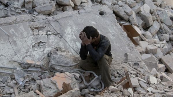 A Syrian boy crys after government airstrike reportedly hit rebel-held area in Aleppo (AFP/File)