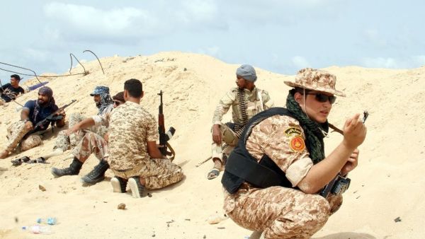 Fighters from the pro-government forces loyal to Libya's Government of National Unity hold a position as they target the Islamic State group in Sirte, June 2016. (AFP/File) 
