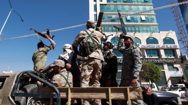 Houthi fighters drive through the Yemeni capital Sanaa (AFP/Mohammed Huwais)