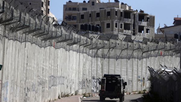 Al-Ram is separated from Jerusalem by Israel's 'separation barrier' (AFP/File) Al-Ram is separated from Jerusalem by Israel's 'separation barrier' (AFP/File)