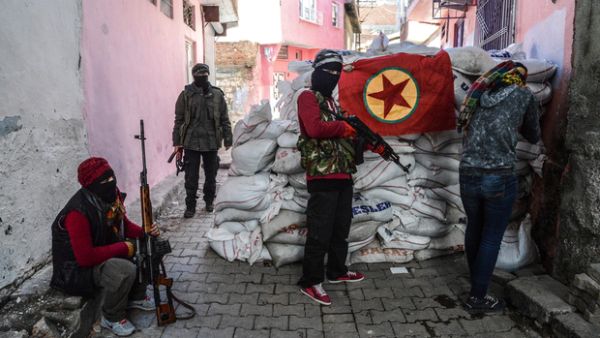 A flag of Kurdish workers Party (PKK) hangs on a barricade as armed Kurdish militants man a barricade, on 18 November 2015 in the Sur district of Diyarbakir. (AFP/File)