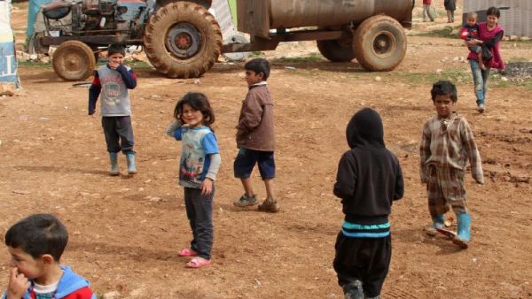 Syrian children play at a refugee camp on the outskirts of the eastern Lebanese city of Baalbek on February 24, 2015. (AFP/File)