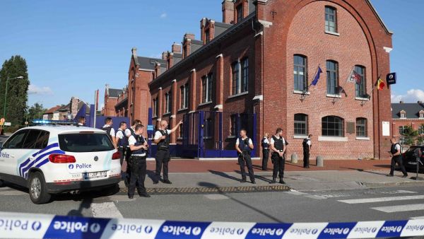 Police stand as they secure the area around a police building in the southern Belgian city of Charleroi following a machete attack. (AFP/File)