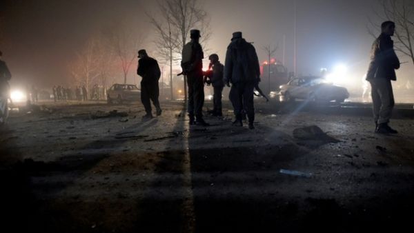 Afghan security personnel inspect the area near the site of an attack by a suicide bomber against a vehicle carrying employees of popular Afghan TV channel TOLO in Kabul on January 20, 2016. (AFP/File) 