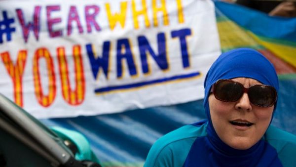 A woman wearing a burkini joins a protest outside the French embassy in London on August 25, 2016 against the banning of the Islamic swimwear on some French beaches. (AFP/Justin Tallis)