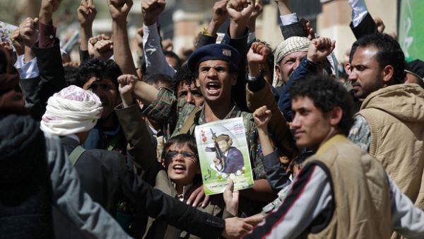 Supporters of the Houthi movement attend the funeral of senior Houthi leader Lutf al-Quhom (AFP/file)