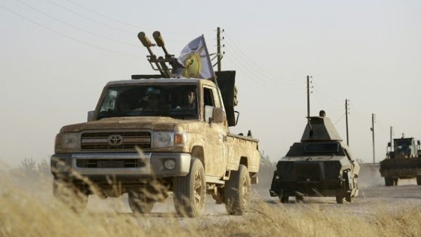 US-backed Kurdish and Arab fighters advance into the Daesh bastion of Manbij, in northern Syria, in June 2016. (AFP/File)