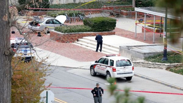 View photos
Police investigate the scene where an individual used a car to crash into a group of students outside of Watts Hall on the Ohio State University campus on November 28, 2016. (AFP/Kirk Irwin)